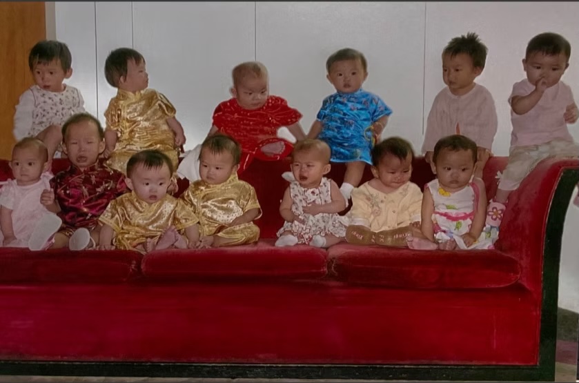 Téa's adoption travel group photo on The Red Couch